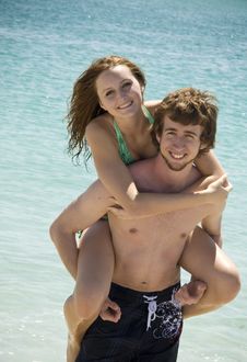 Playful Young Beach Couple Stock Photo