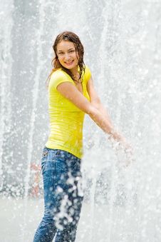 Young Caucasian Girl Playing At Fountain Royalty Free Stock Images