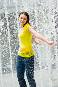 Young Caucasian Girl Playing At Fountain Royalty Free Stock Photos