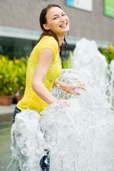 Young Caucasian Girl Playing At Fountain Royalty Free Stock Photography