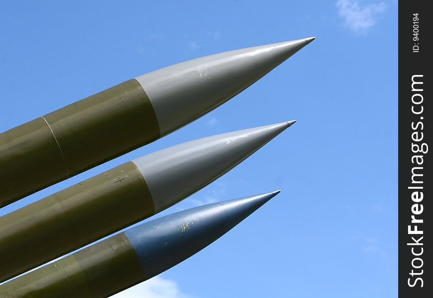 Three military missiles with peaks to the heaven