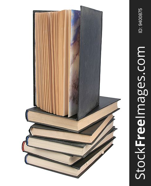 Pile of books and the open book on a white background