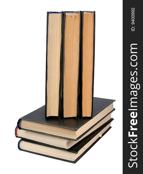 Pile of books and the open book on a white background