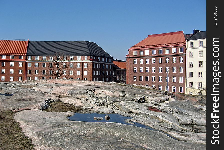 Colorful houses around the Temppeliaukio (Rock) Church in Helsinki, Finland