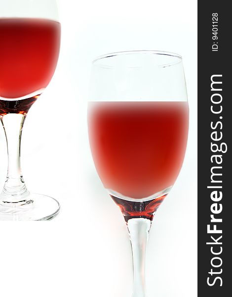 Glass of red wine on white