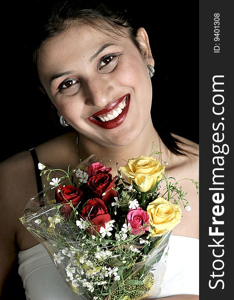 Smiling bride with rose bouquet