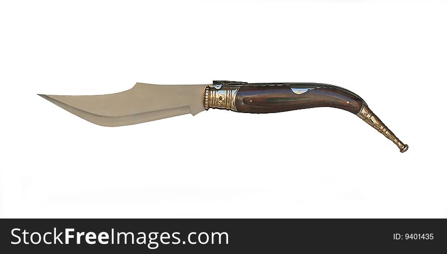 The Spanish knife with the wooden handle isolated on a white background