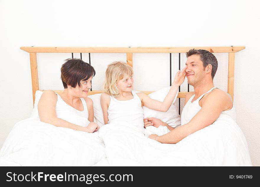 Young family three in a bed. Young family three in a bed