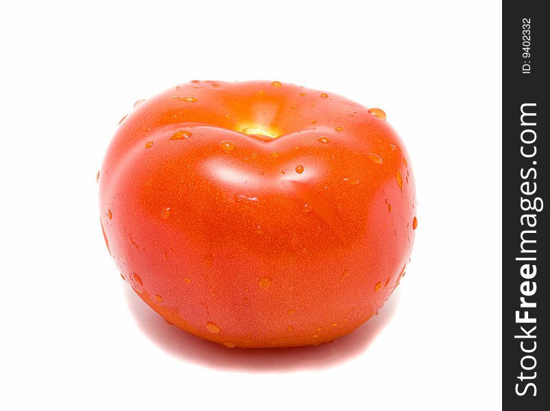 Red ripe tomato with drops of water isolated