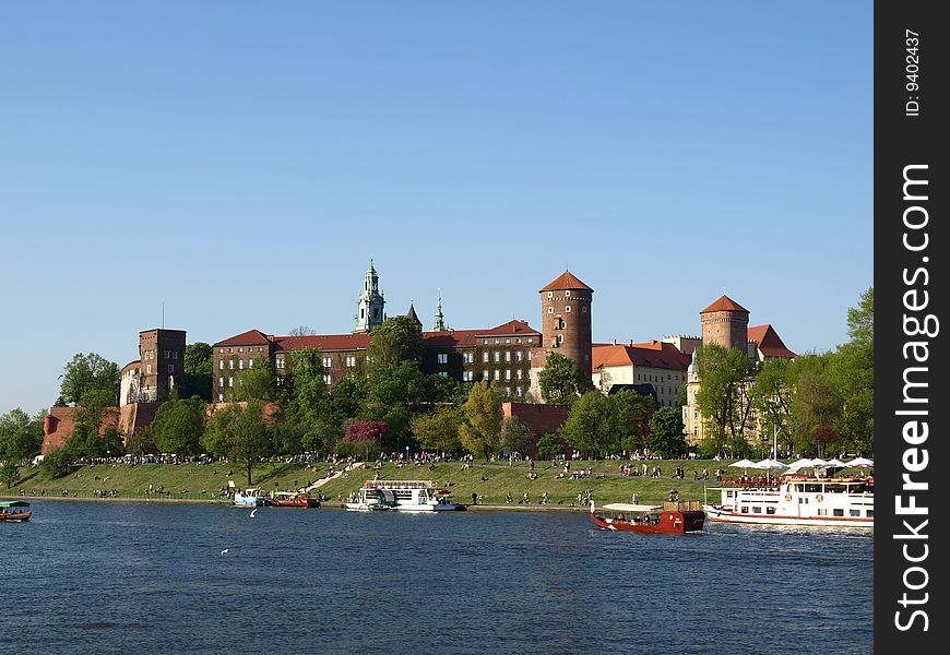 Wawel is an outcrop on the left bank of the Vistula River in KrakÃ³w, Poland. This is a place of great significance for the Polish people. The Royal Castle with an armoury and the Cathedral are situated on the hill. Polish Royalty and many distinguished Poles are interred in the Wawel Cathedral. Royal coronations took place there also. Wawel is an outcrop on the left bank of the Vistula River in KrakÃ³w, Poland. This is a place of great significance for the Polish people. The Royal Castle with an armoury and the Cathedral are situated on the hill. Polish Royalty and many distinguished Poles are interred in the Wawel Cathedral. Royal coronations took place there also.