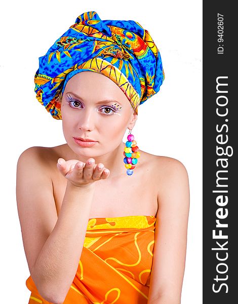 Beautiful girl with in colorful clothes and hat with bright make-up
