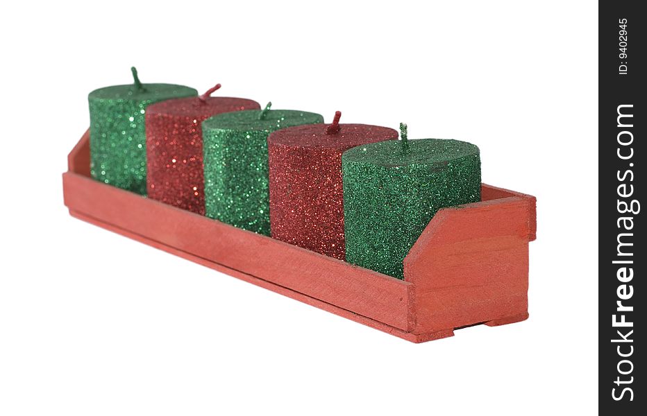 Cristmas candles stay in wood rest (isolated). Cristmas candles stay in wood rest (isolated)