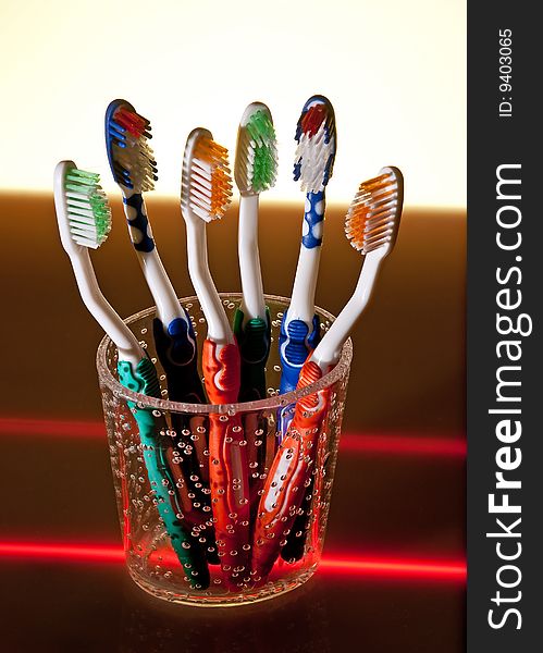 Toothbrushes in cup, studio shoot