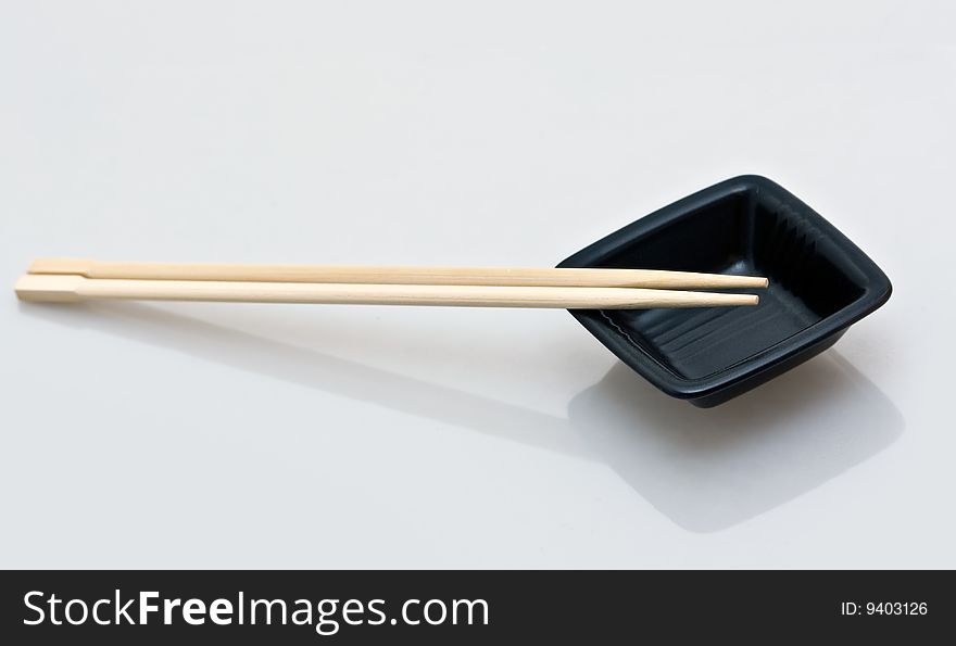 Chopsticks and a wasabi dish