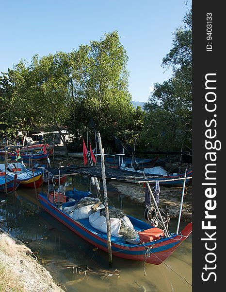 Malaysian small fishing village with boats