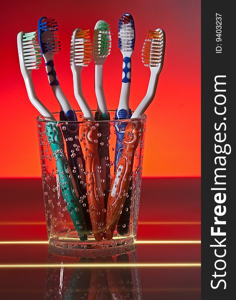 Toothbrushes in cup, studio shoot