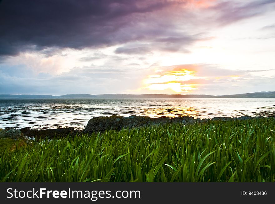 Sun set over lockranza with grass in the foreground