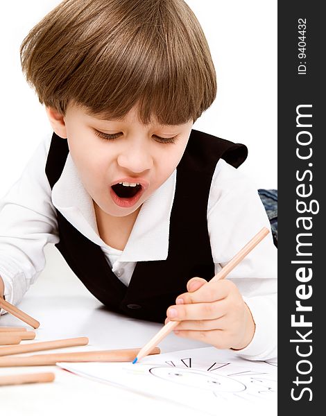 Adorable little boy with pencil, over white