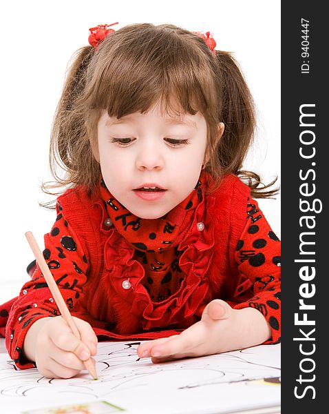 Little girl drawing with pencil