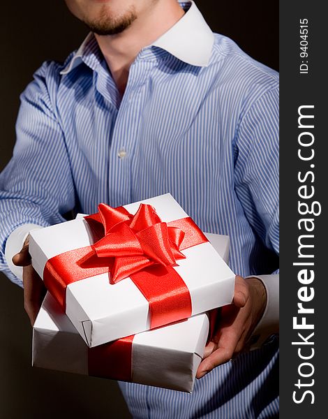 Man holding fine wrapped gift box