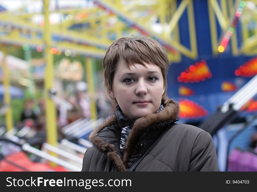 The woman poses on a play area. The woman poses on a play area