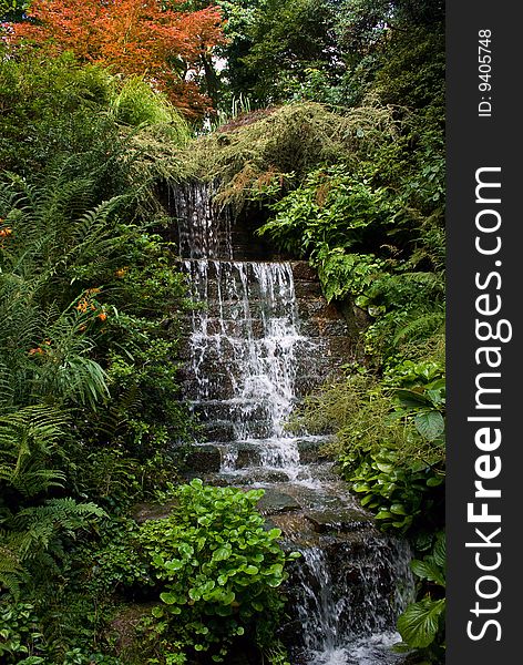 Stream flowing over rocks and down a bank. Stream flowing over rocks and down a bank