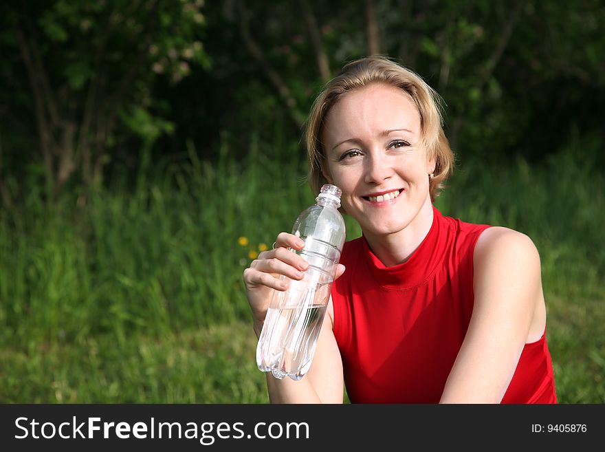 Woman with the bottle of water