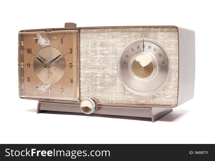 Vintage Clock Radio Facing Left Isolated on a White Background. Vintage Clock Radio Facing Left Isolated on a White Background.