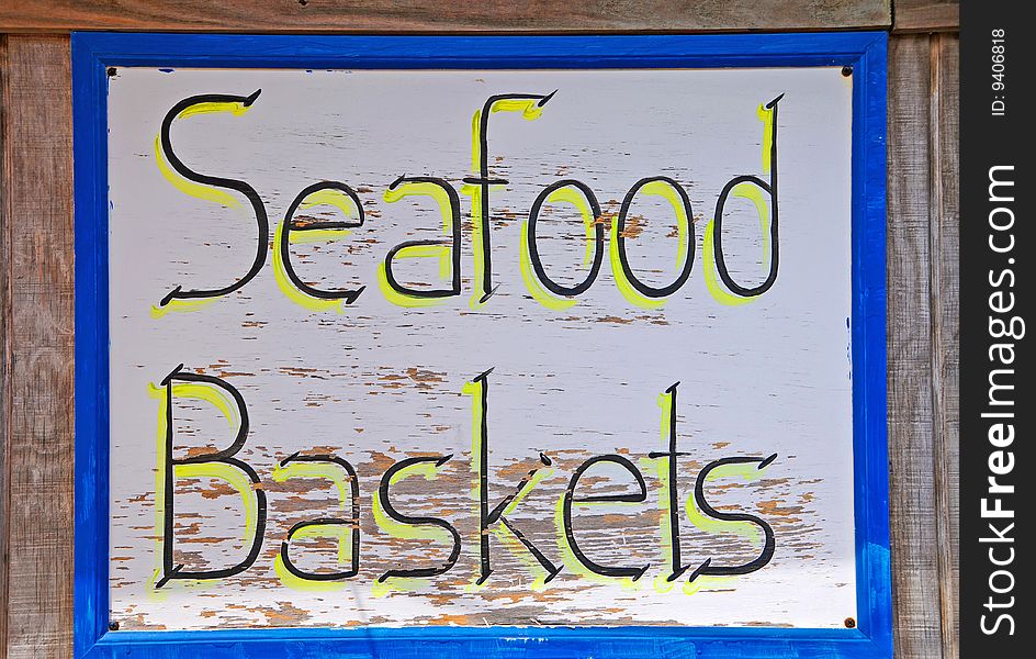 Weathered Resturant Sign advertising Seafood Baskets