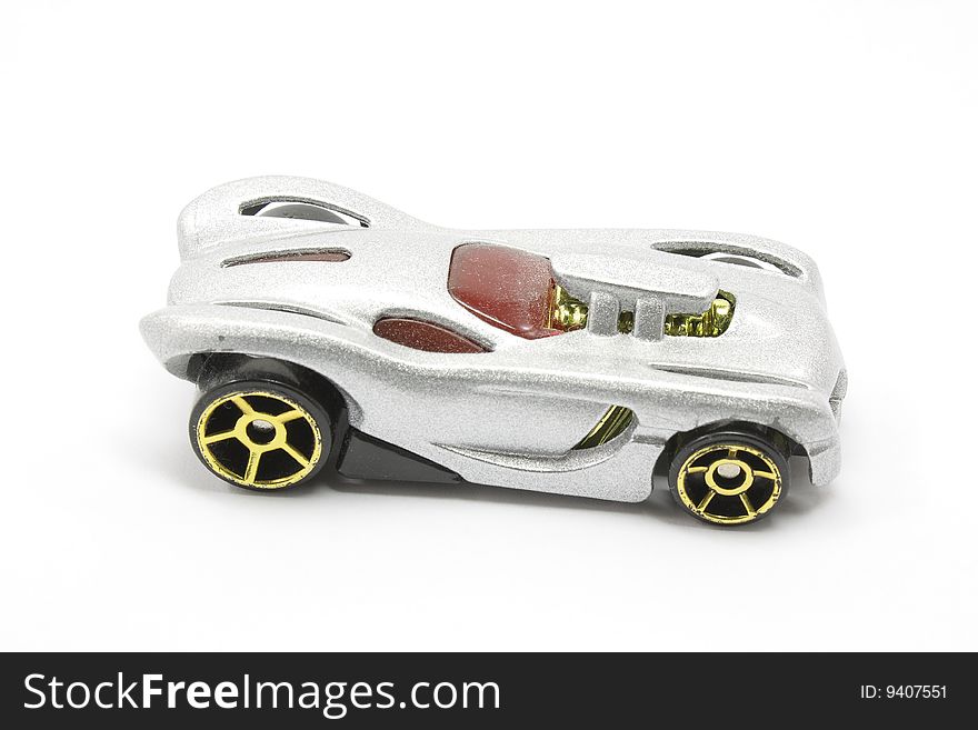 Toy car with silver sparkle finish on it against white background. Toy car with silver sparkle finish on it against white background.