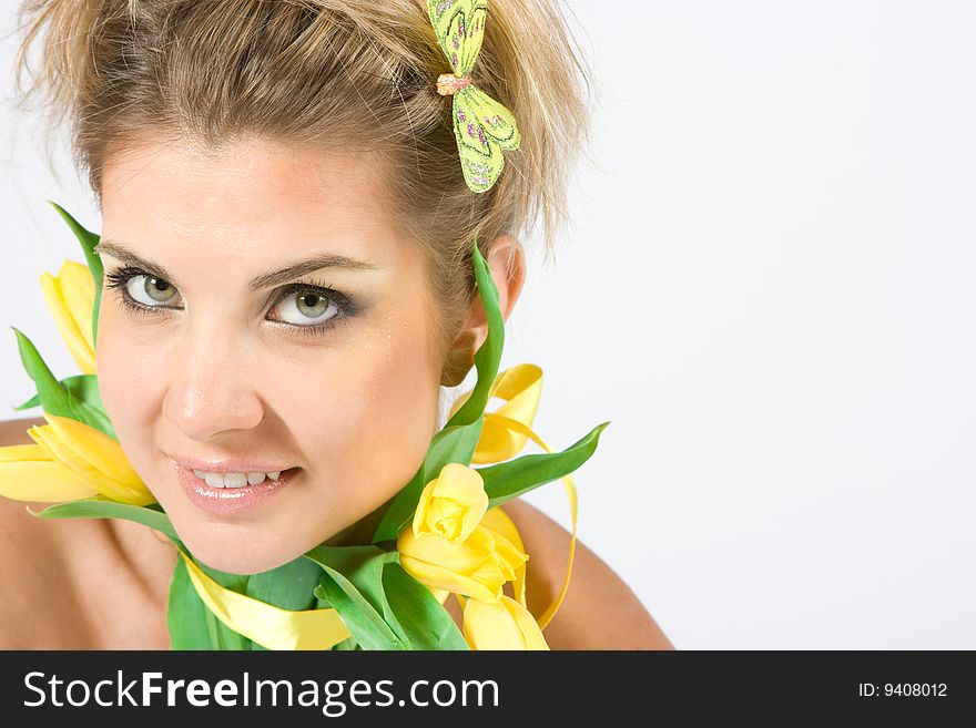 Girl with tulips isolated on white