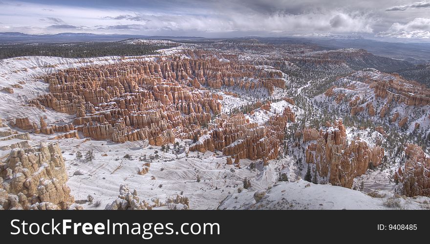 High dynamic range (HDR) panorama of the Amphitheater from Inspiration Point at sunrise after a snowfall. Bryce Canyon National Park, UT. High dynamic range (HDR) panorama of the Amphitheater from Inspiration Point at sunrise after a snowfall. Bryce Canyon National Park, UT.