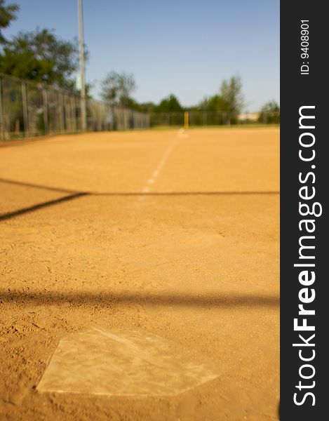 Short depth of field shot of home plate looking towards third base