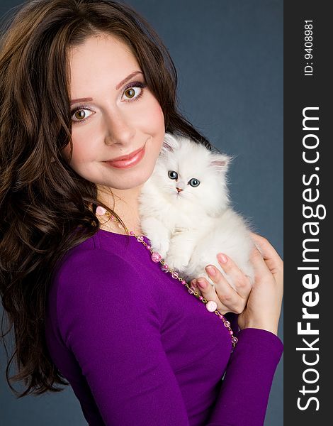 Beautiful Girl In Purple Dress Holding Little Whit