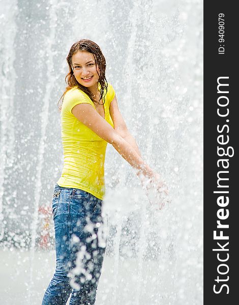 Young Caucasian Girl Playing At Fountain