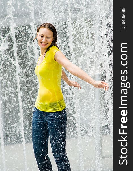 Young Caucasian Girl Playing At Fountain