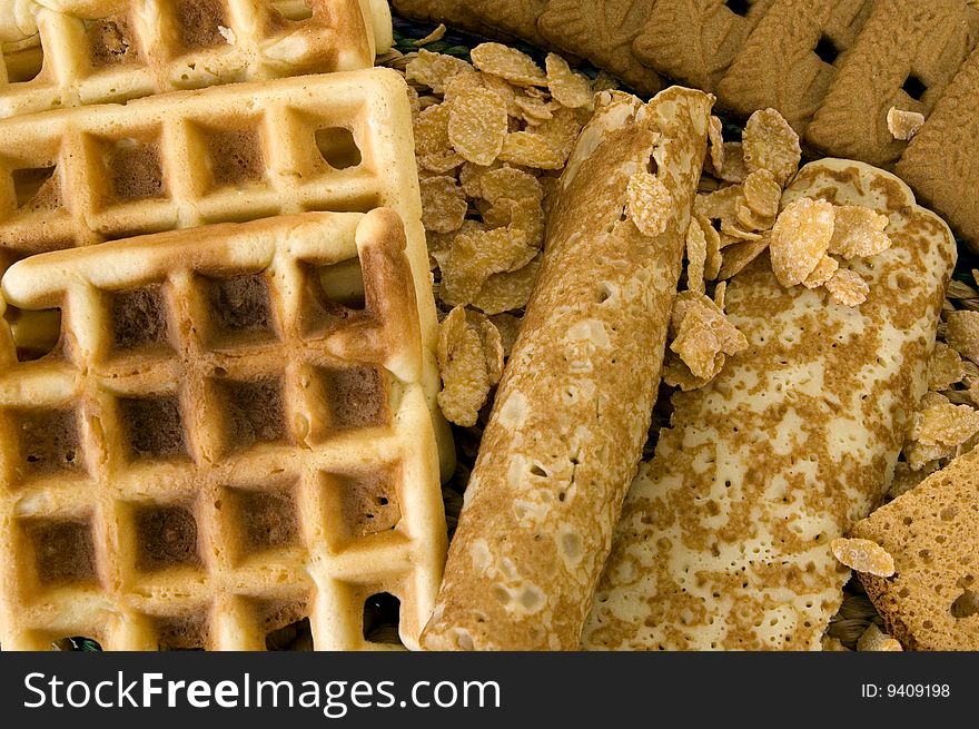 Variety of sweets, waffles pancakes spiced cookies and cornflakes