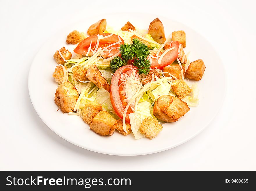 Salad with tomatos and cheese over white