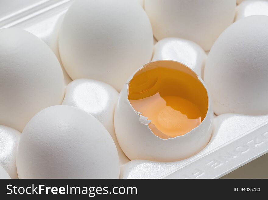 Chicken eggs in the cassette box on a white background