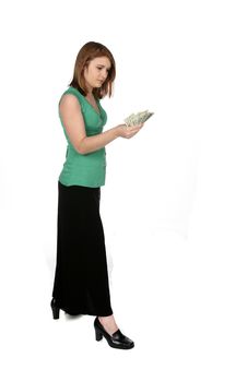 Teenage Girl Looking At A Handful Of Cash Royalty Free Stock Image