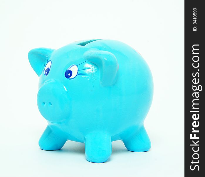 A blue piggy bank on background