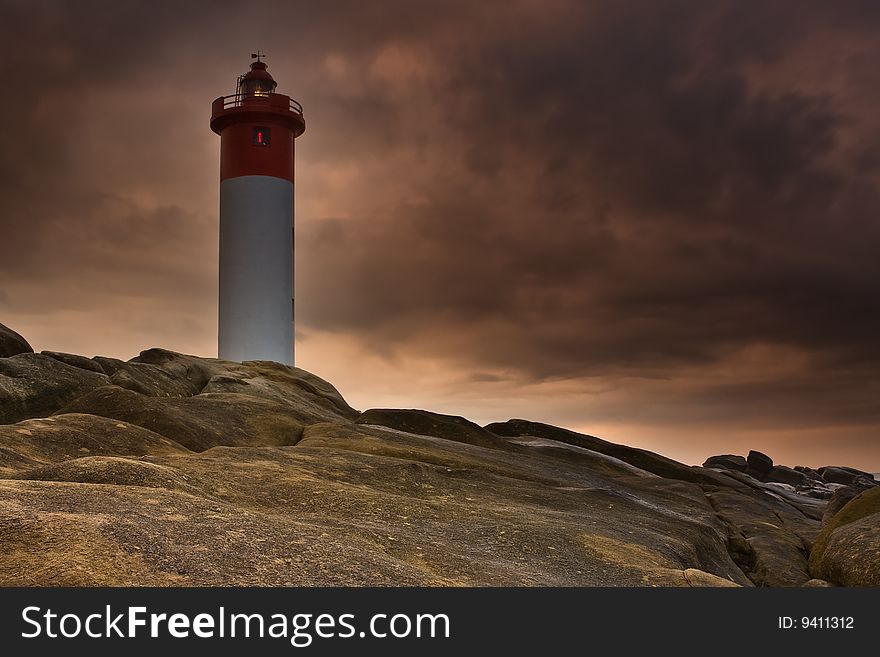 Umhlanga Lighthouse on the rocky coast of South Africa. Umhlanga Lighthouse on the rocky coast of South Africa