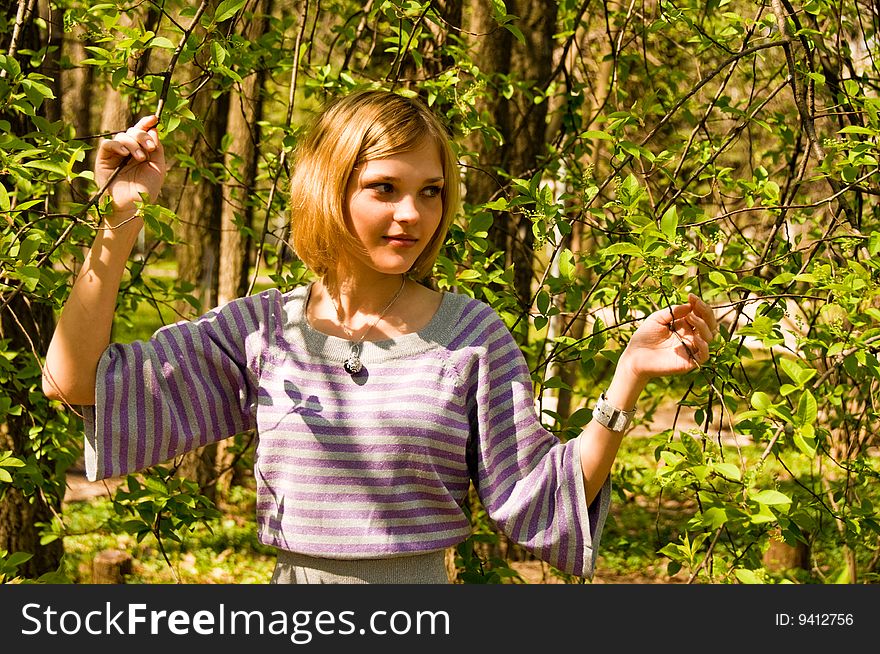 Portrait of young beautiful woman in the forest