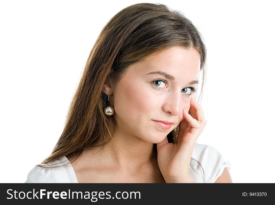 A portrait of a beautiful young woman in a white dress with enigmatic expression