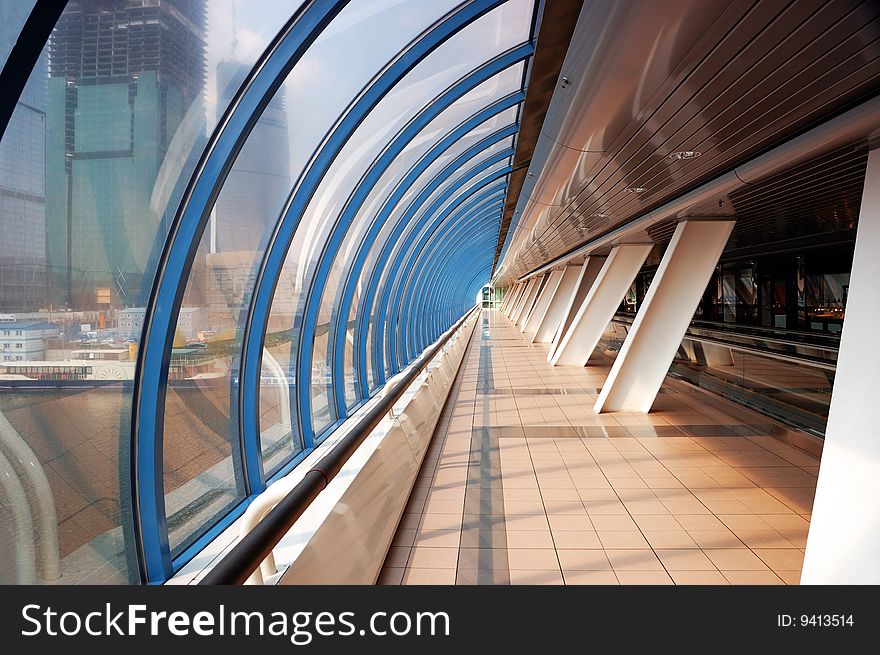 Pedestrian bridge interior and skyscrapers