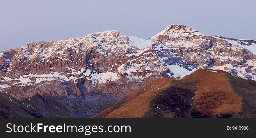 Snowy mountain at sunset in the Pyrenees. Snowy mountain at sunset in the Pyrenees
