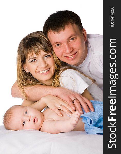 mother and father holding their little child studio shot