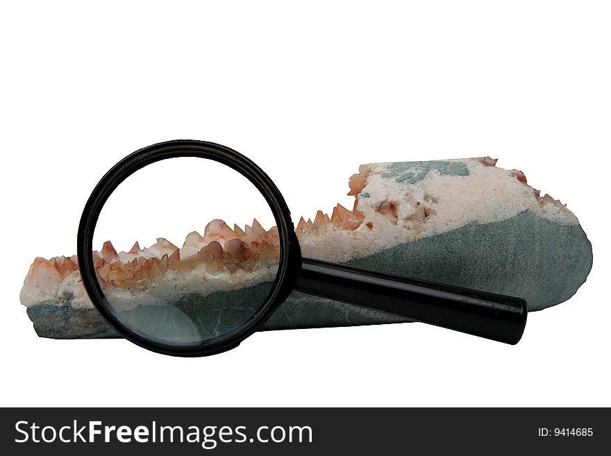 Brush with crystals of a carbonate and quartz with a magnifier on a white background. Brush with crystals of a carbonate and quartz with a magnifier on a white background