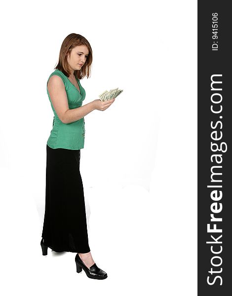 Teenage girl looking at a handful of cash