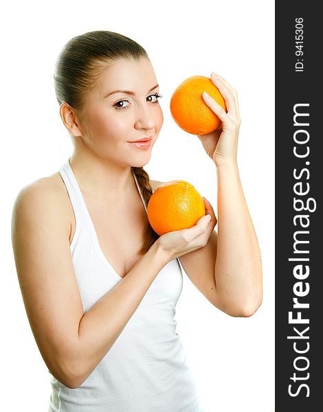 Beautiful girl with two juicy oranges stuido shot